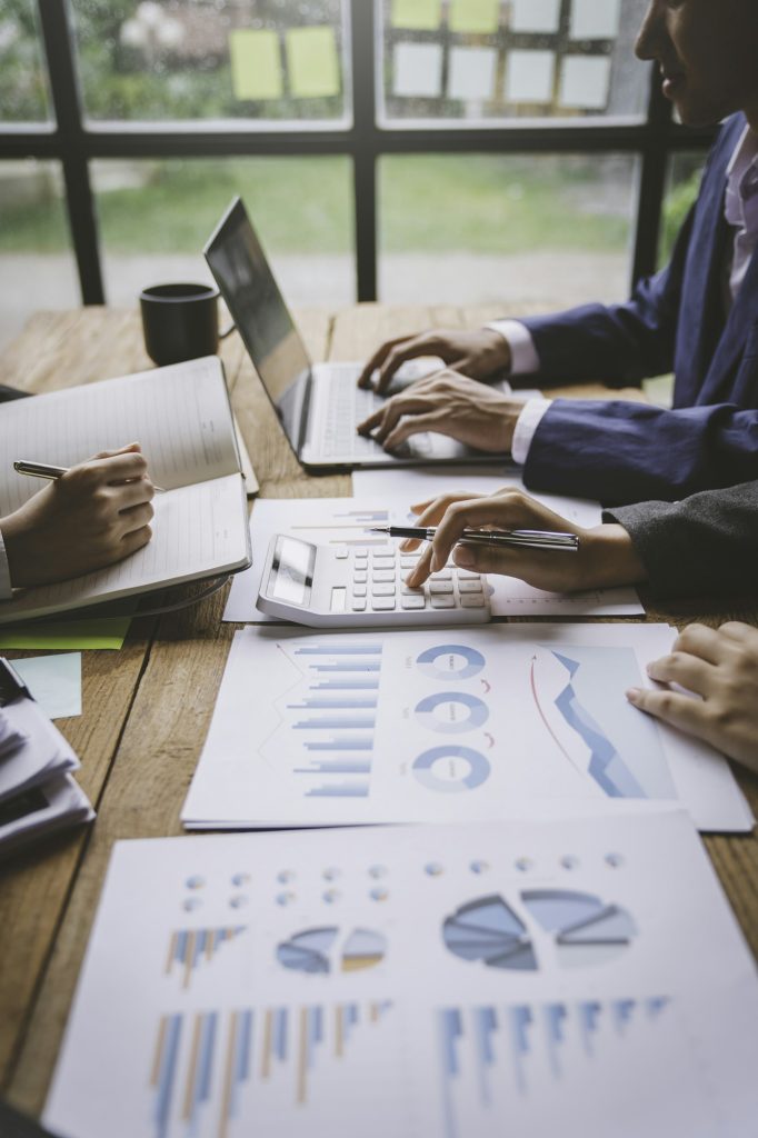 A business team consultant describes a marketing plan to set business strategies for business owners